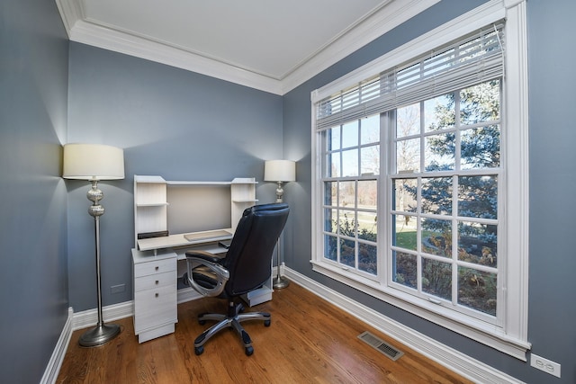 office area featuring hardwood / wood-style flooring and crown molding