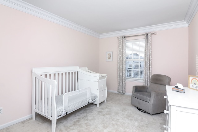 bedroom featuring light carpet, a nursery area, and ornamental molding