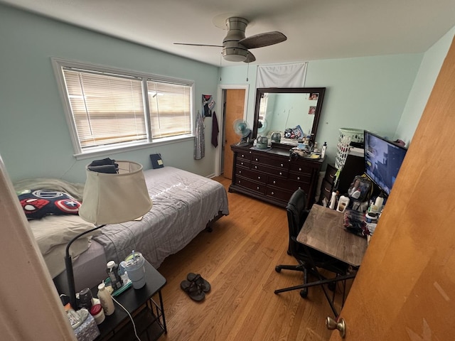 bedroom with light wood-type flooring and ceiling fan