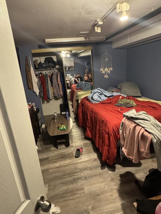 bedroom featuring hardwood / wood-style flooring