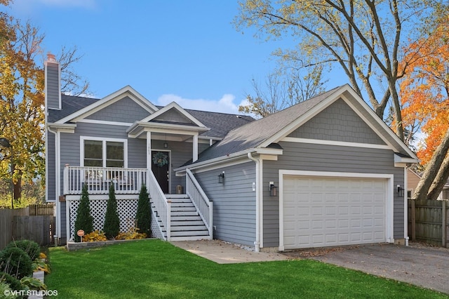 view of front of home featuring a front lawn and a garage