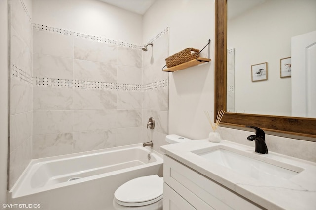 full bathroom with vanity, toilet, and tiled shower / bath