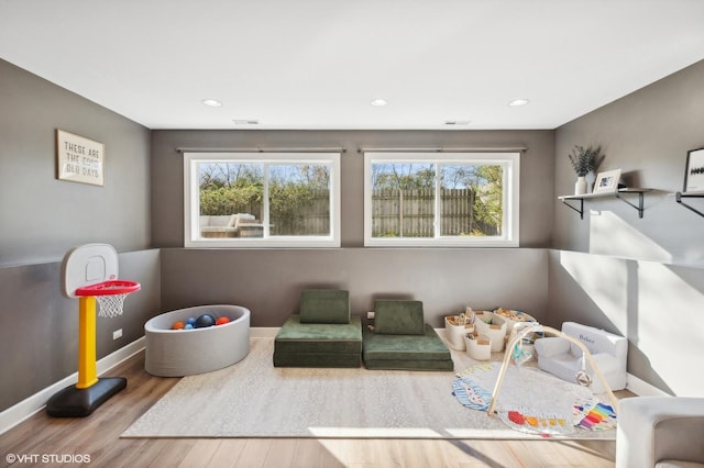 playroom with hardwood / wood-style floors