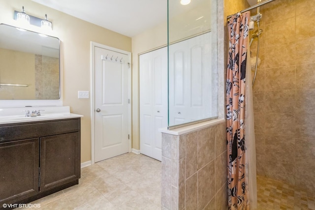 bathroom featuring vanity and curtained shower