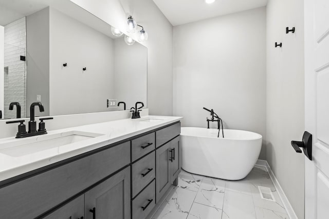 bathroom with vanity and a tub to relax in