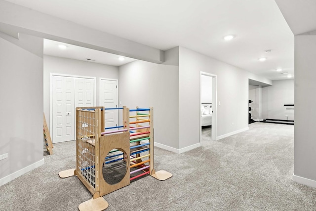 playroom featuring light colored carpet