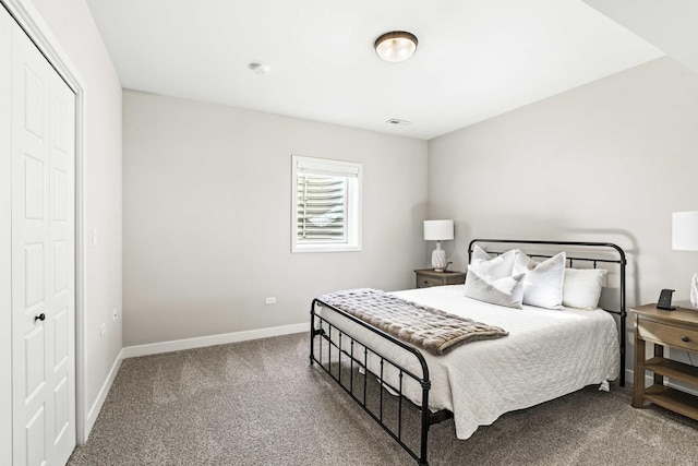 carpeted bedroom featuring a closet