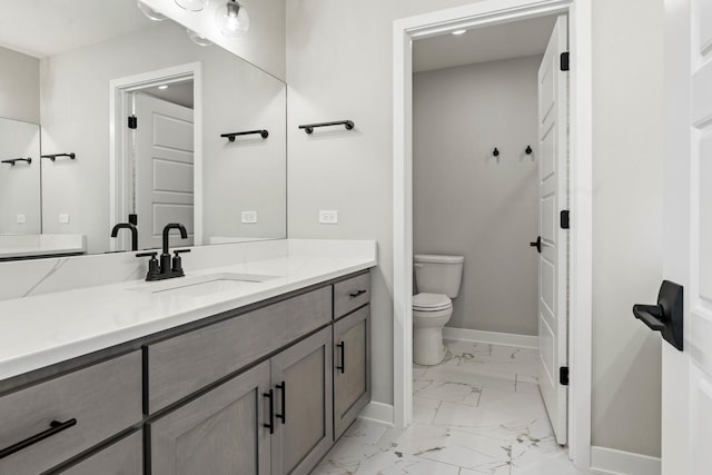 bathroom with vanity and toilet