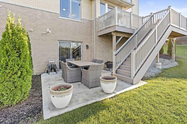 view of patio / terrace with a fire pit and a deck