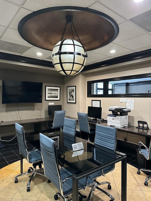 tiled home office featuring a drop ceiling