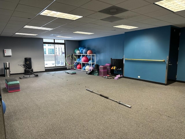 rec room featuring carpet and a drop ceiling