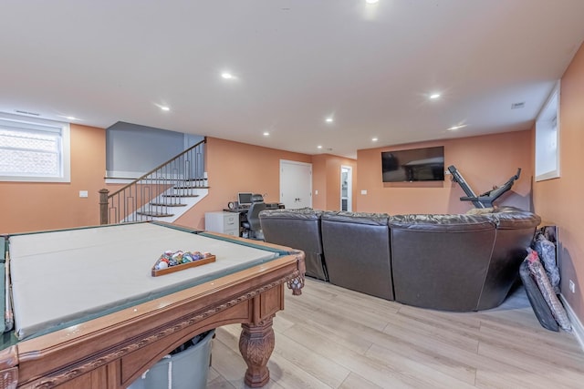 rec room with pool table and light hardwood / wood-style floors