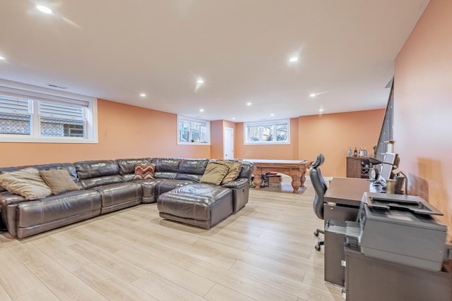 living room with light hardwood / wood-style flooring