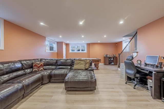 living room featuring billiards and light hardwood / wood-style flooring