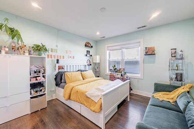 bedroom featuring dark hardwood / wood-style floors