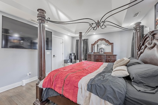 bedroom with wood-type flooring