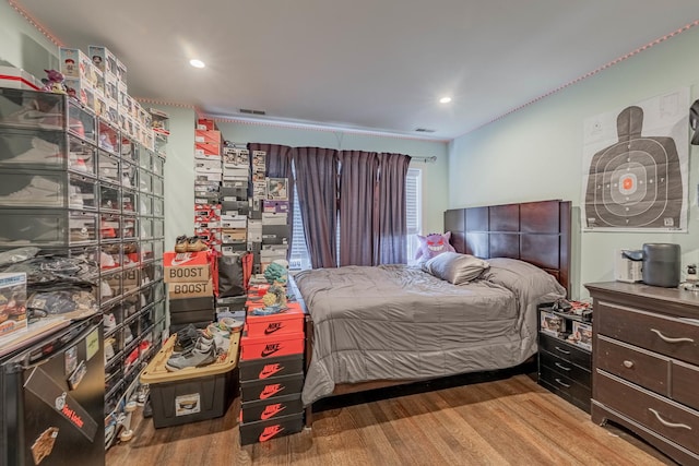 bedroom with wood-type flooring