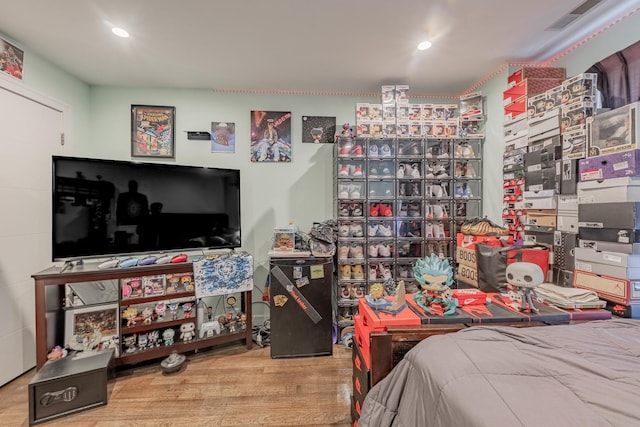 bedroom with hardwood / wood-style floors