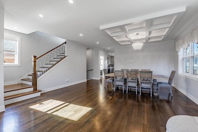 dining space featuring beamed ceiling, coffered ceiling, dark hardwood / wood-style floors, and an inviting chandelier