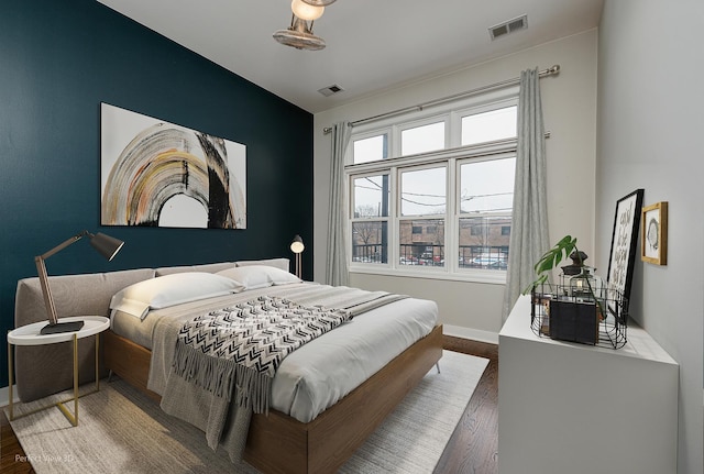 bedroom featuring dark wood-type flooring