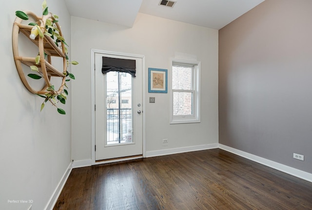 doorway featuring dark wood-type flooring