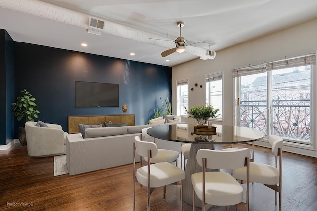 dining room with ceiling fan and dark hardwood / wood-style floors