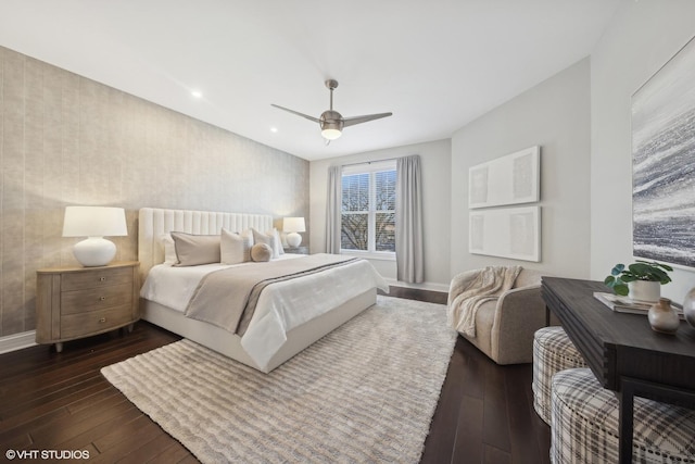 bedroom with ceiling fan and dark hardwood / wood-style floors