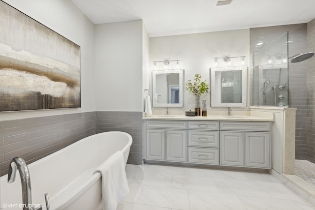 bathroom with vanity, tile walls, and plus walk in shower