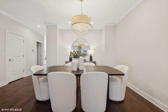 dining area featuring a notable chandelier, dark hardwood / wood-style floors, and ornamental molding