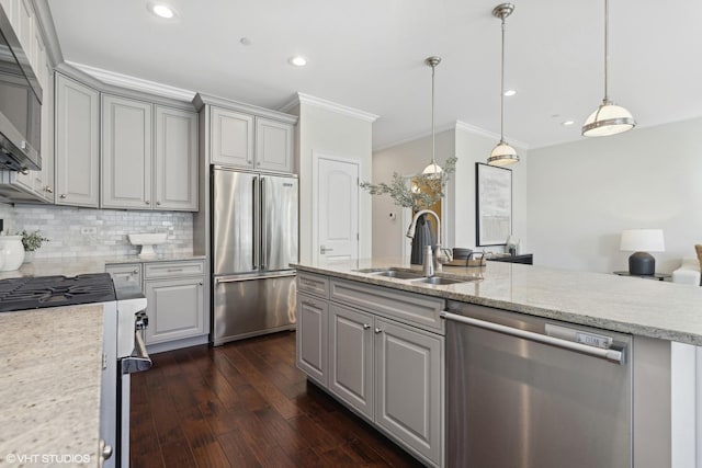 kitchen featuring sink, gray cabinets, light stone countertops, ornamental molding, and appliances with stainless steel finishes