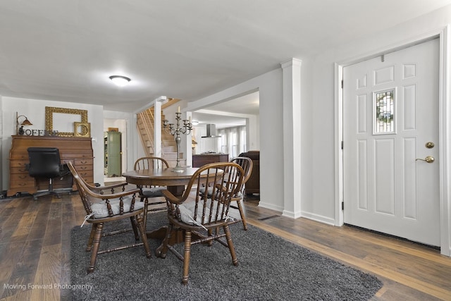 dining area featuring dark hardwood / wood-style floors