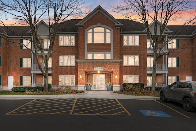 view of outdoor building at dusk