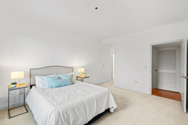 bedroom with light colored carpet