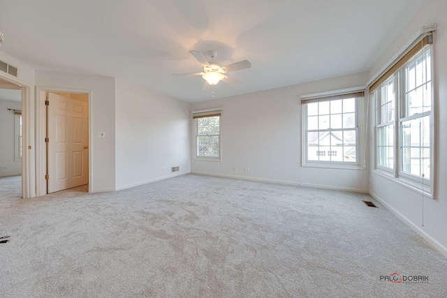 carpeted empty room with ceiling fan