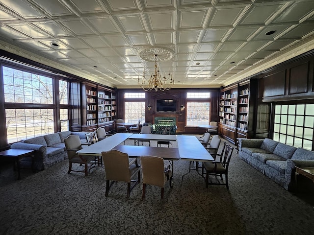 dining space with carpet flooring and a notable chandelier