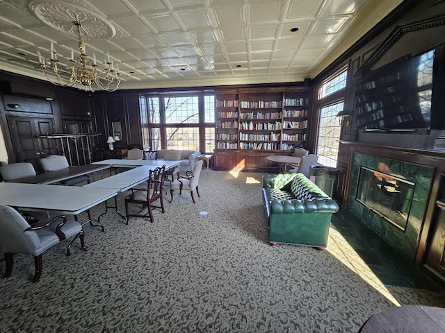 dining area featuring carpet and a notable chandelier