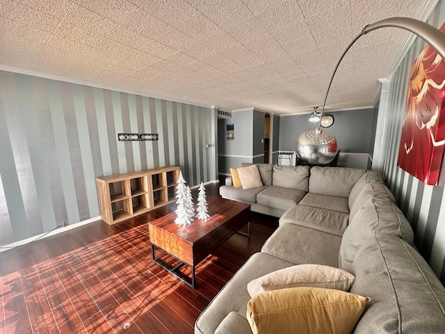 living room with dark hardwood / wood-style flooring and crown molding