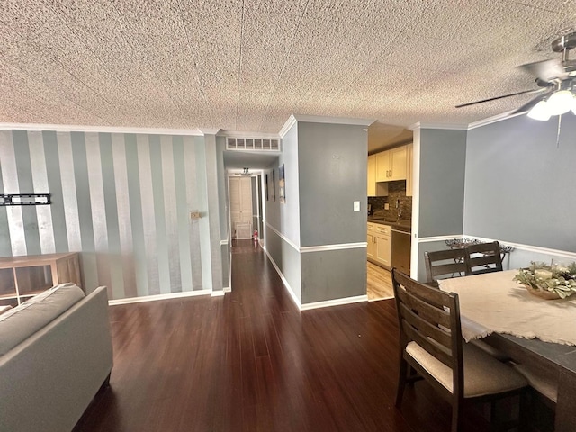 dining room with ceiling fan, wood-type flooring, and ornamental molding