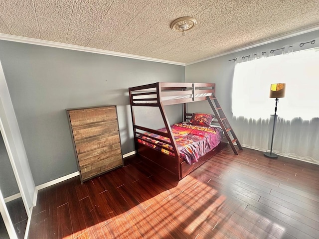 bedroom featuring dark hardwood / wood-style flooring and crown molding