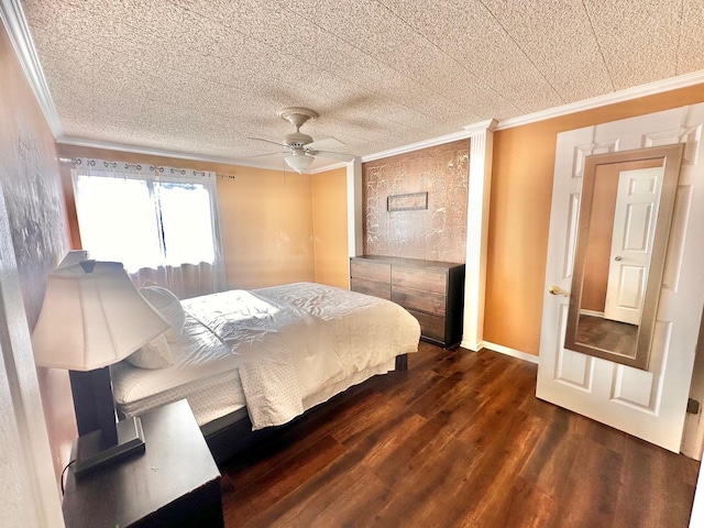 bedroom featuring dark hardwood / wood-style flooring, ceiling fan, and ornamental molding