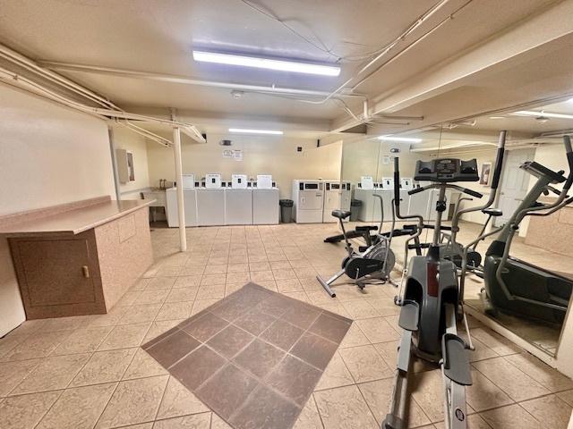 workout area with independent washer and dryer