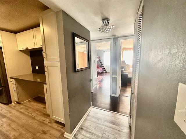 hall featuring light hardwood / wood-style flooring