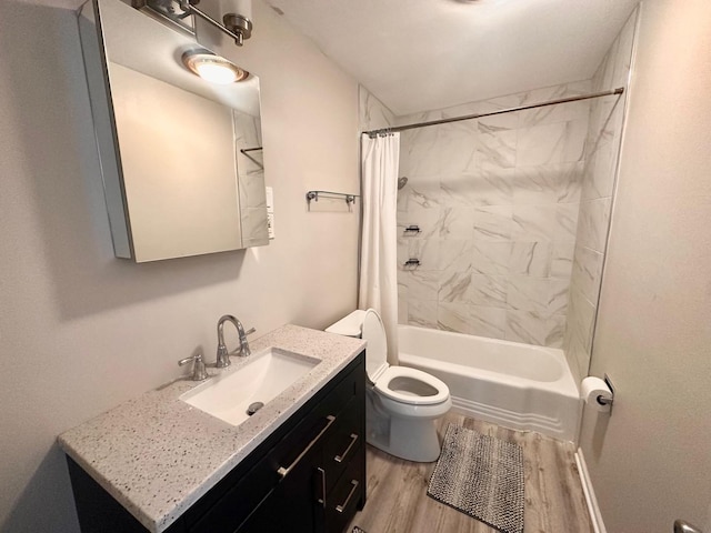 full bathroom featuring hardwood / wood-style flooring, vanity, toilet, and shower / bath combo with shower curtain