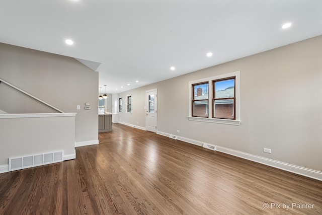 unfurnished living room with hardwood / wood-style floors