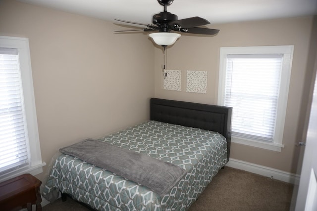 bedroom with ceiling fan and carpet flooring