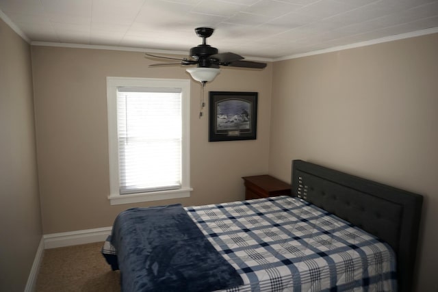 bedroom featuring crown molding, ceiling fan, and carpet