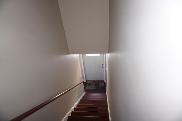 stairway featuring hardwood / wood-style floors