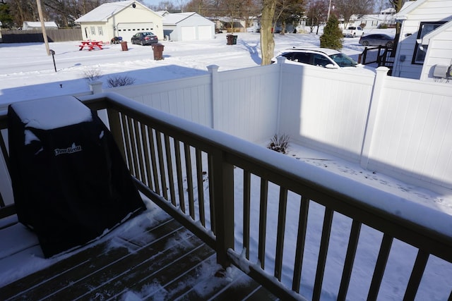 snow covered deck with grilling area