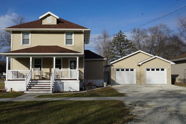 view of front of property with a garage and covered porch