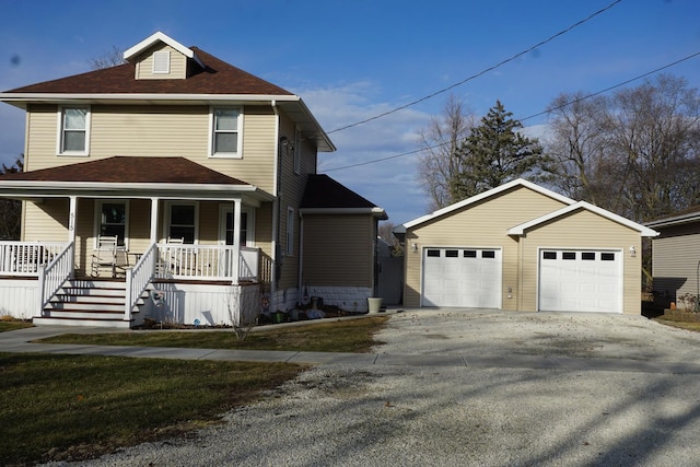 view of front property featuring a garage and covered porch